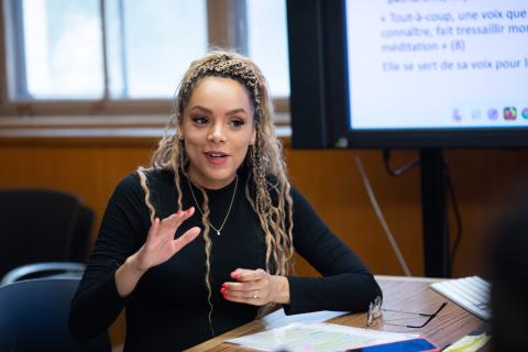 Student speaking in a conference room