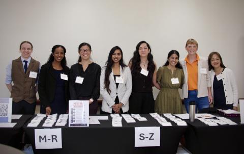 postdoc volunteers at check-in table