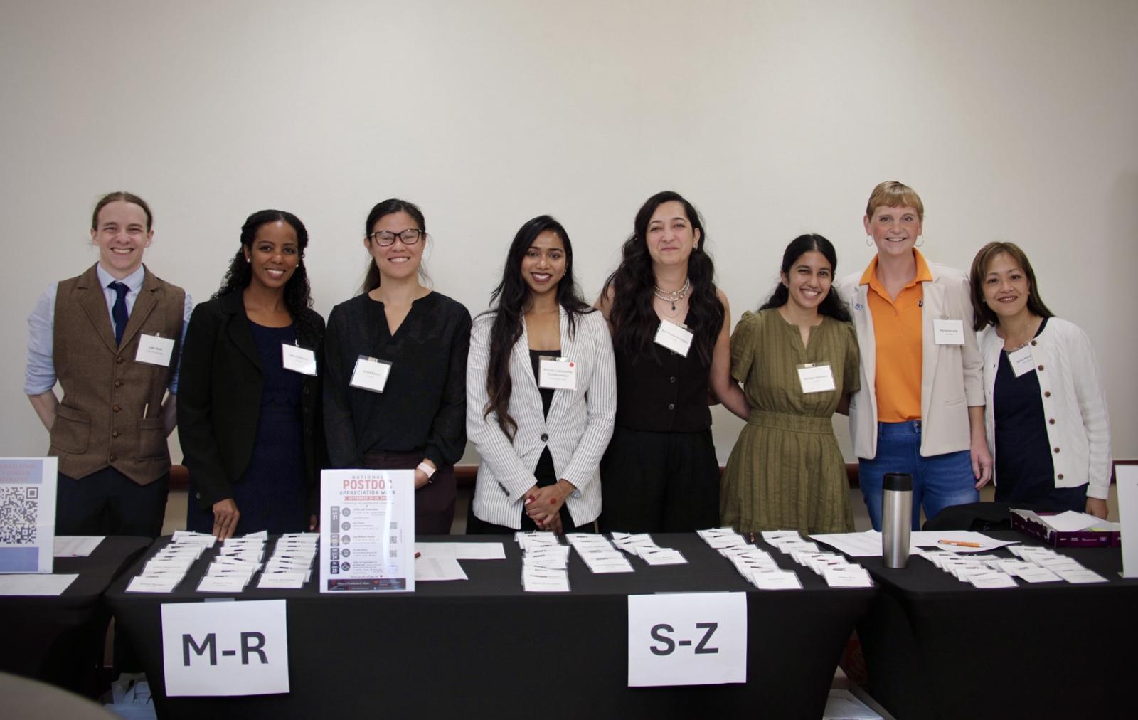 postdoc volunteers at check-in table