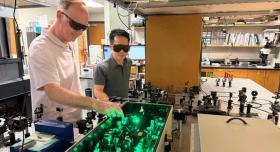 Biomedical engineering professor Andrew Dunn and Hengfa Lu, a postdoctoral student in the lab where they developed brain blood flow monitoring technology.