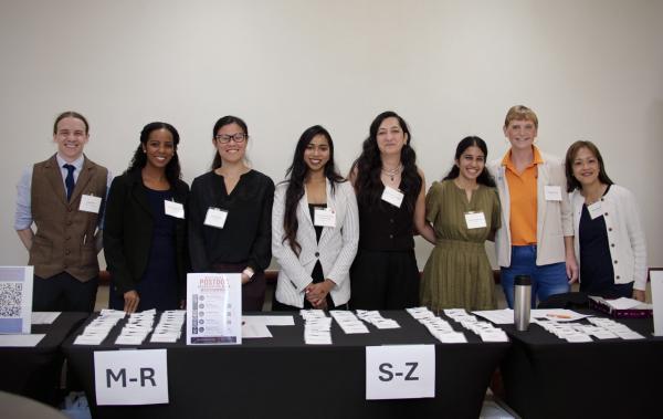 postdoc volunteers at check-in table