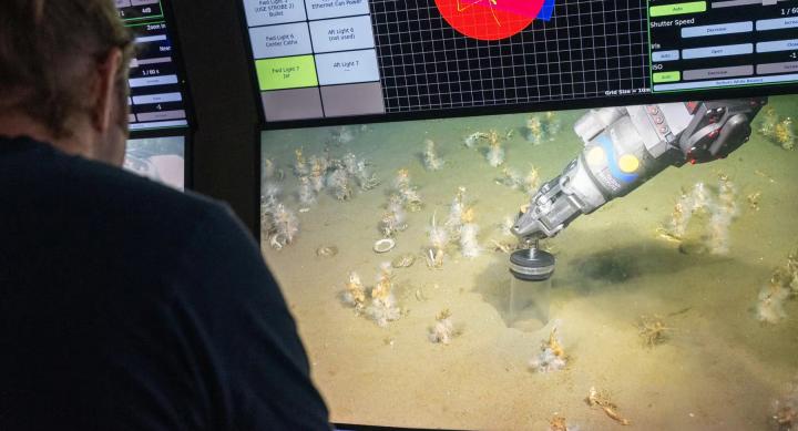 A person pilots a remotely operated machine on a computer screen.